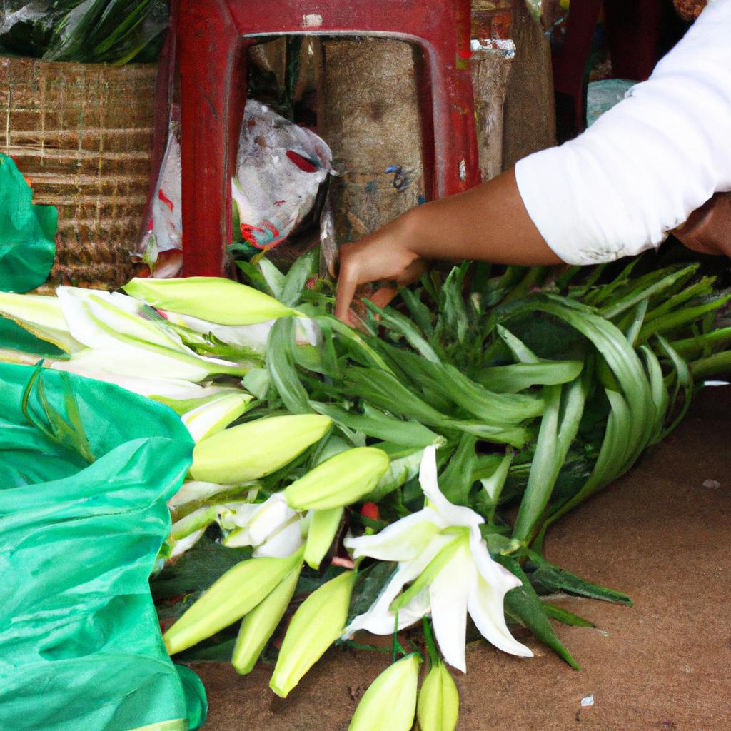 Person arranging lilies for sale